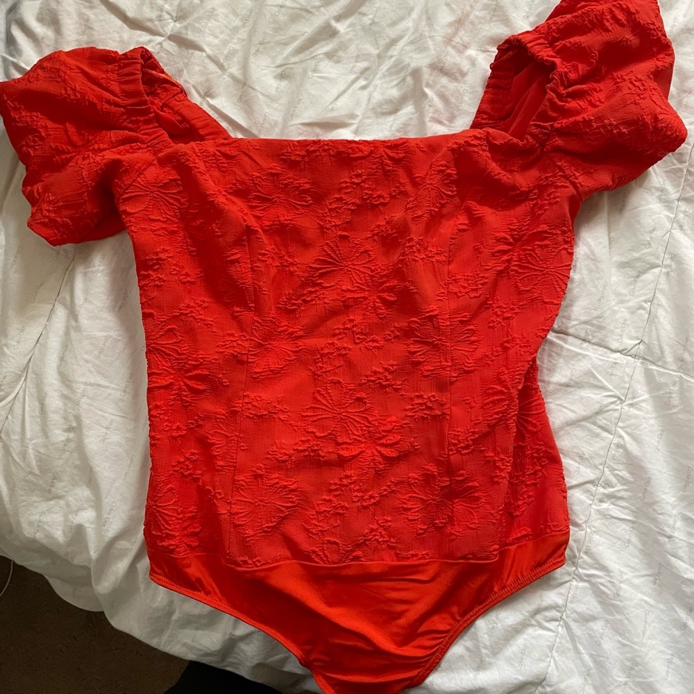 red/salmon body suit leotard